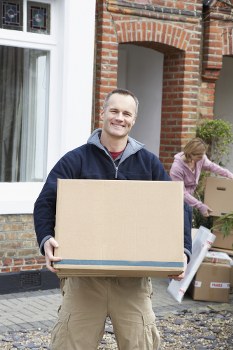 Removal van and moving boxes in a Feltham residential street