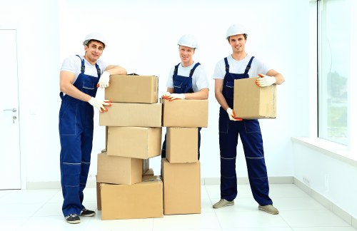 Packed household items ready for transport by a removals team