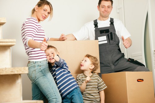 Movers transporting office items during a Feltham business relocation